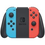 Nintendo Switch OLED avec plusieurs jeux affichés sur l’écran.